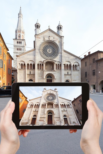 Tourist taking photo of Modena Cathedral