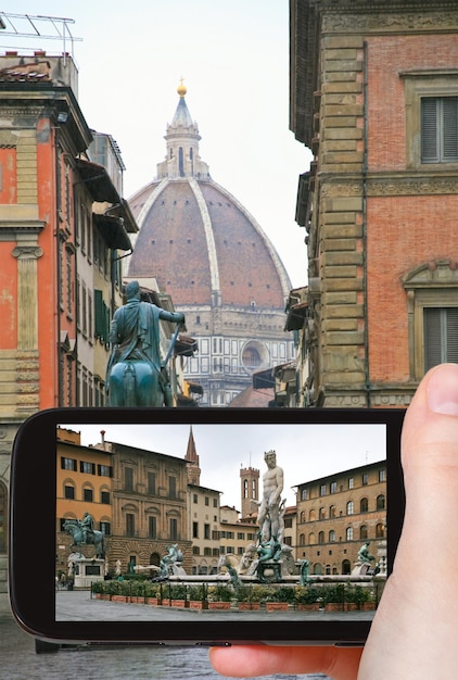 Tourist taking photo of Piazza della Signoria