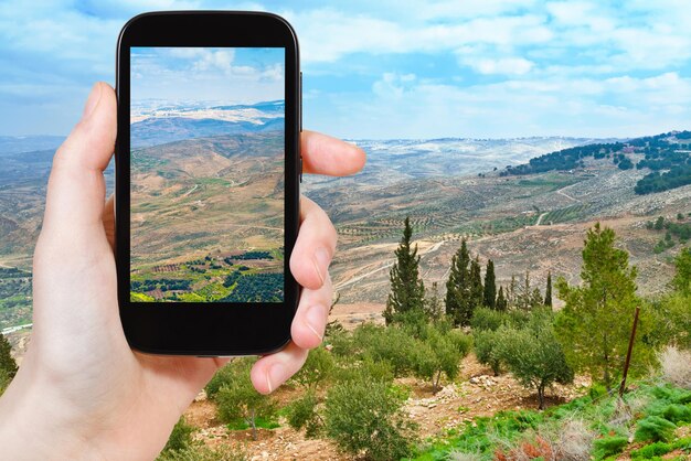 Tourist taking photo of Promised Land