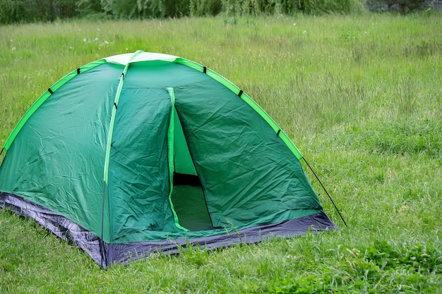 Tourist tent, outdoor recreation near the river. nature,\
recreation, camping. selective focus