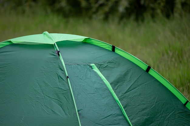 Tourist tent, outdoor recreation near the river. nature,
recreation, camping. selective focus