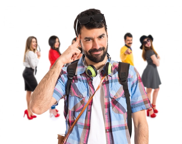 Tourist thinking over white background  