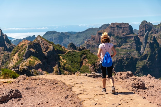 A tourist on the trekking trail at Pico do Arieiro Madeira Portugal