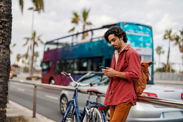 A tourist using an online app for directions during his vacation in Spain