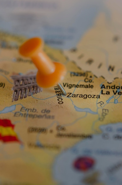 Photo tourist vertical map of the city of zaragoza in spain in travel concept with a push pin marking the destination