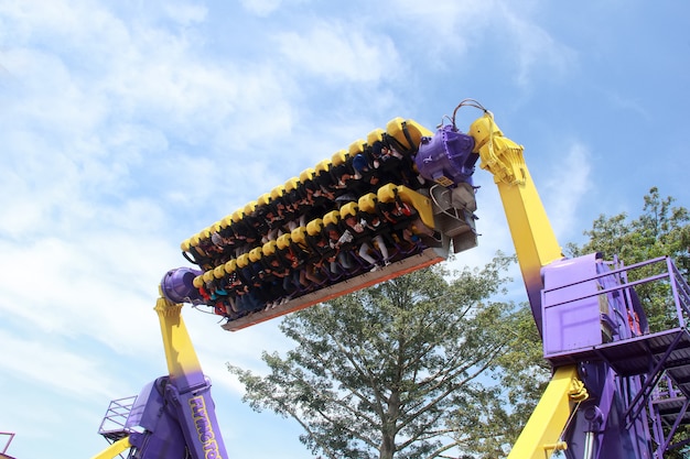 Tourist visitors are busy playing rides with flying tornadoes