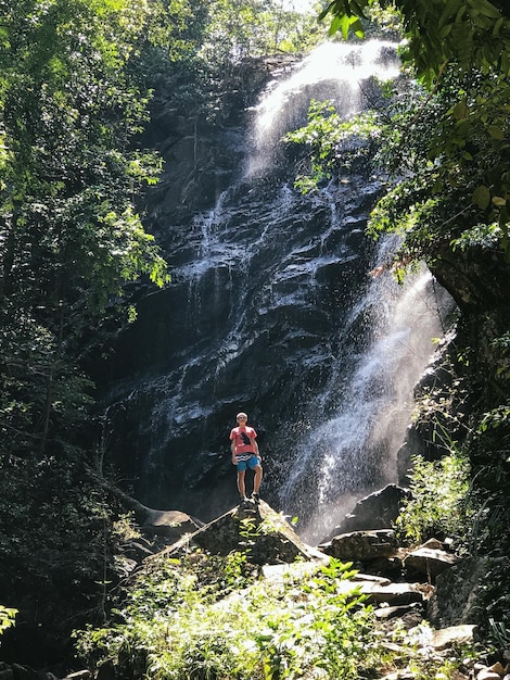 tourist at waterfall