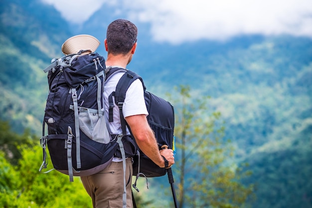 Tourist with backpacks enjoying view on the Annapurna track