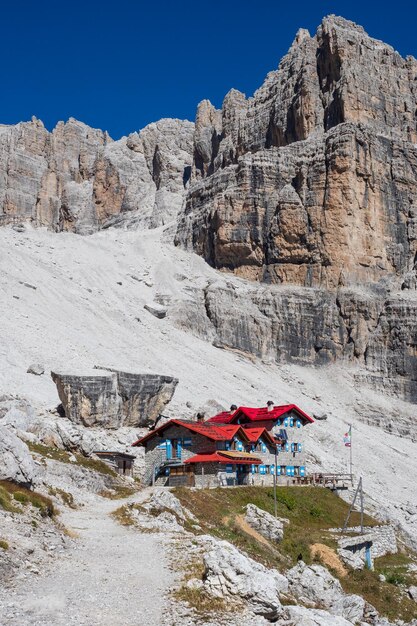 Tourist with hiking backpacks in mountain hike on summer day