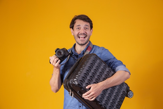 Tourist with mud and camera in hand to travel