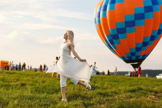 A tourist woman enjoying wonderful view of the balloons. Happy Travel concept