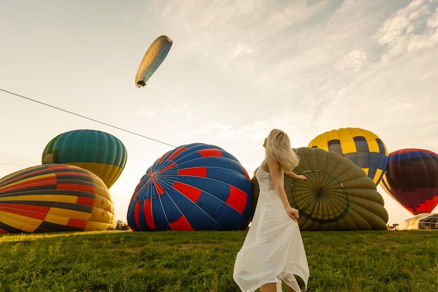 A tourist woman enjoying wonderful view of the balloons. Happy Travel concept