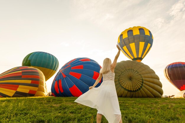 A tourist woman enjoying wonderful view of the balloons. Happy Travel concept