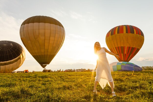 A tourist woman enjoying wonderful view of the balloons. Happy Travel concept