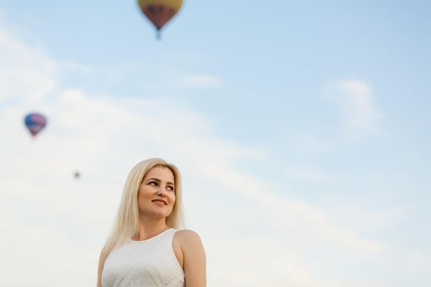 A tourist woman enjoying wonderful view of the balloons. Happy Travel concept