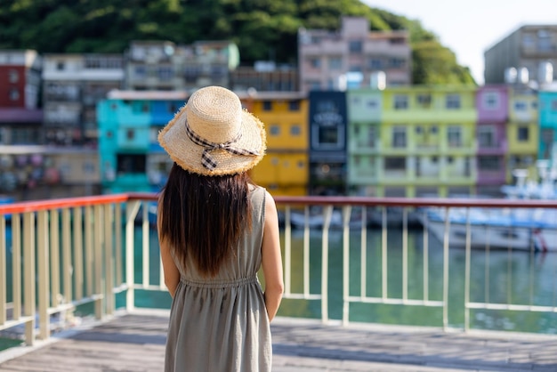 Tourist woman go Keelung Zhengbin bay in Taiwan