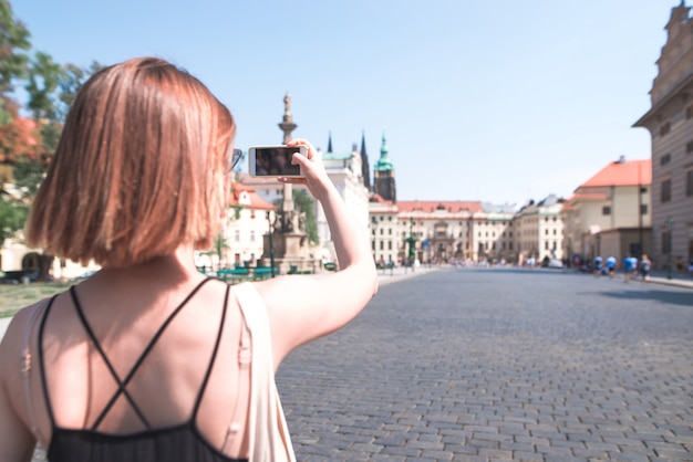 Tourist woman strolling through Prague