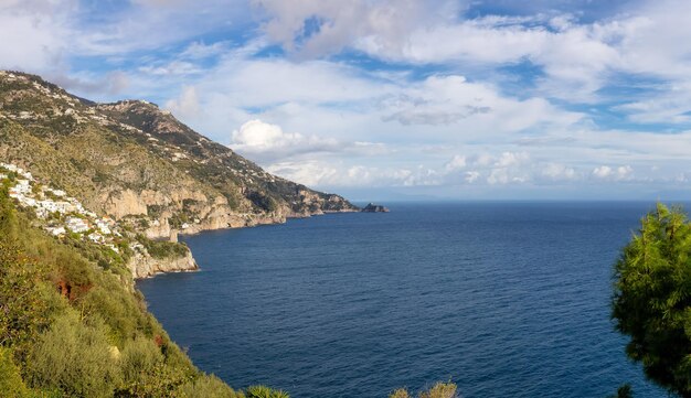 Touristic town vettica maggiore on rocky cliffs and mountain landscape by the tyrrhenian sea amalfi coast italy panorama