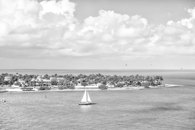 Touristic yacht floating by green island at Key West Florida