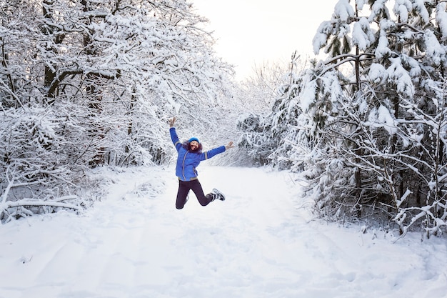 Tourists are walking in the winter forest