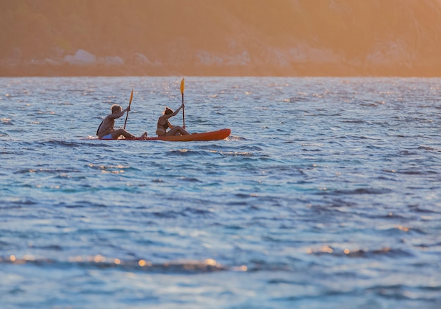 Tourists canoeing on the beautiful sea