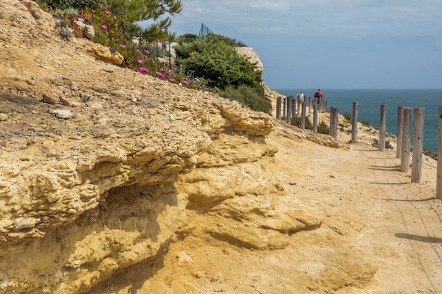 Tourists hiking on beautiful cliffs