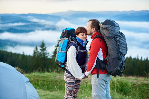 Tourists in the morning in the mountains