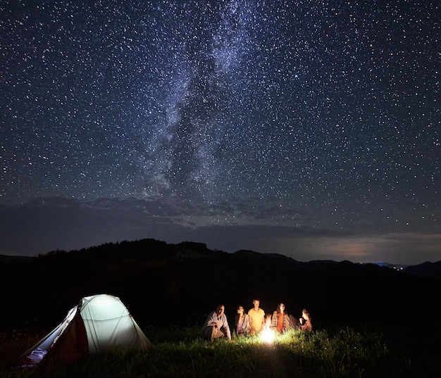 Tourists in the mountains by night