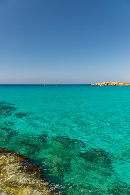 Tourists relax and swim on one of the most popular beaches on the island.