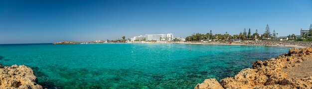 Tourists relax and swim on one of the most popular beaches on the island.