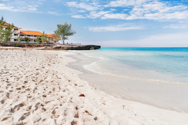 Tourists relax on Varadero sandy beach. 