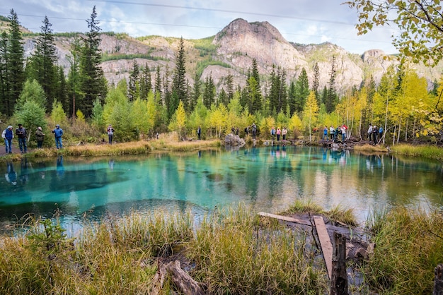 Tourists on the shore of Geyser Lake