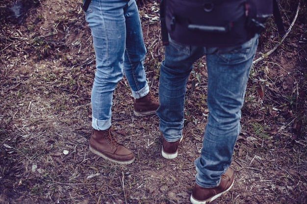 Photo tourists traveling in the forest.