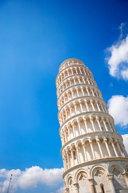 Tourists visiting the leaning tower of Pisa , Italy