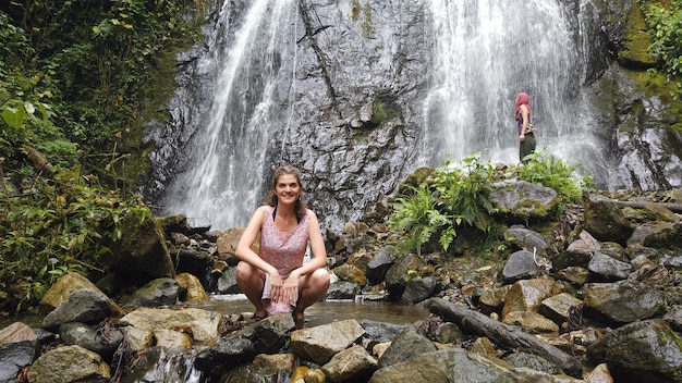 Tourists visiting waterfalls in the jungle of Peru Quillabamba