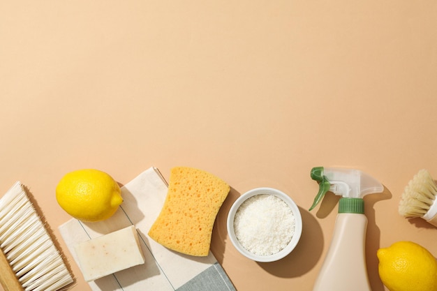 towel brushes sponge and ingredients for natural detergent on beige background space for text