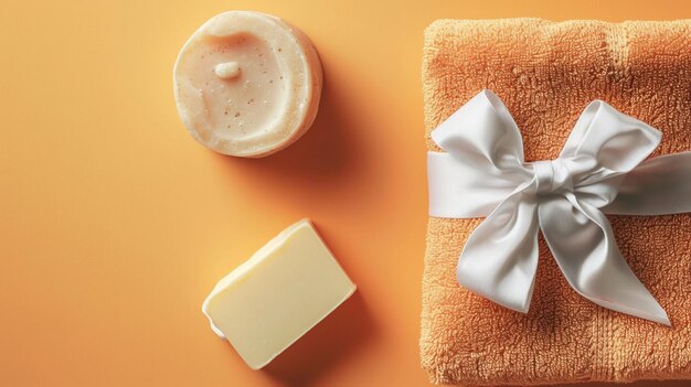 Towel and soap on an orange background