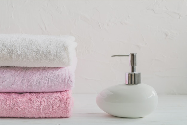 towel and soap on white background, spa water treatment set