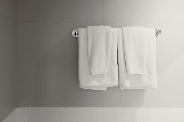 Photo towel white clean new rack hanging shower room service in hotel bathroom