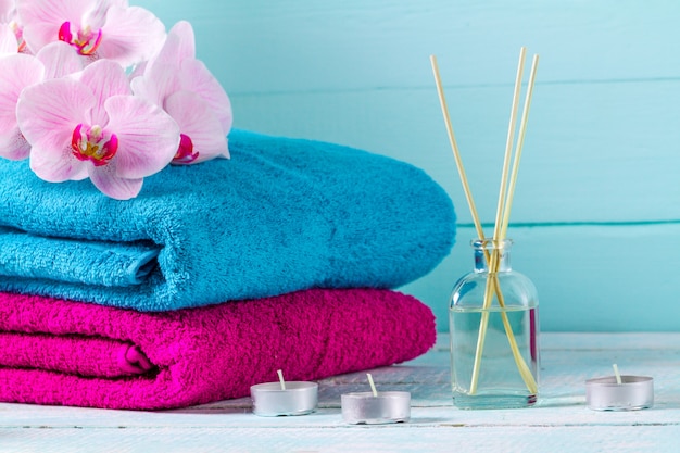 Towels on a background of blue, wooden background. Hygiene. Shower. Bathroom. Copy space