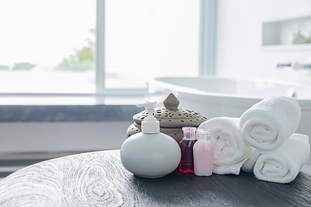 Photo towels and bottles on table