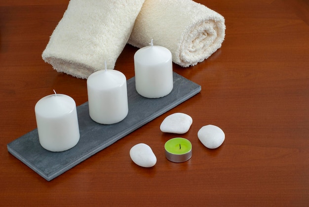 Towels candles stones and orchid