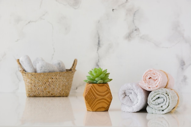 Towels set with basket on table