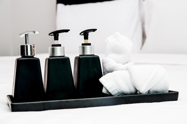 Photo towels with moisturizers in tray at bathroom