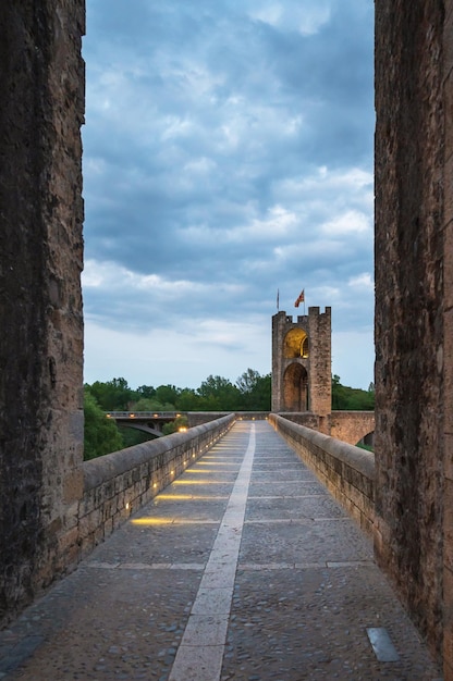 Tower of the Besalu Bridge at sunset Spain