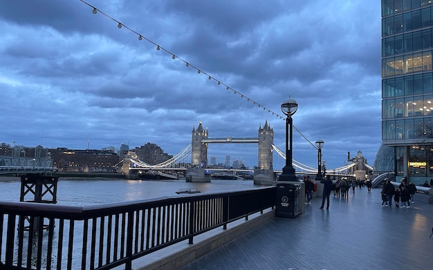 Tower bridge with a few people walking London