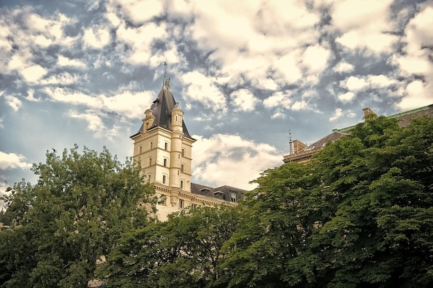 Tower on cloudy sky High beautiful tower Overrated tourist attractions Building tower and spire architecture and design Summer city tour Vacation destinations Explore european architecture