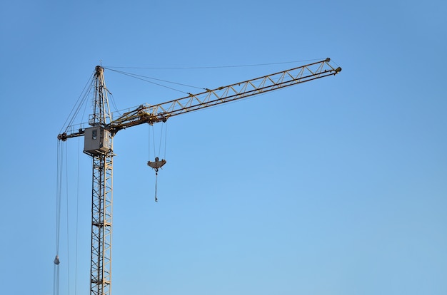 Tower crane against a blue sky