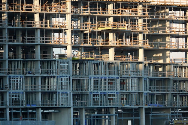 Tower cranes and frame structure of high residential apartment buildings at construction site Real estate development