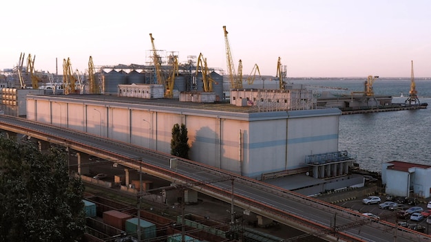 Tower cranes on the odesa sea port evening urban cityscape